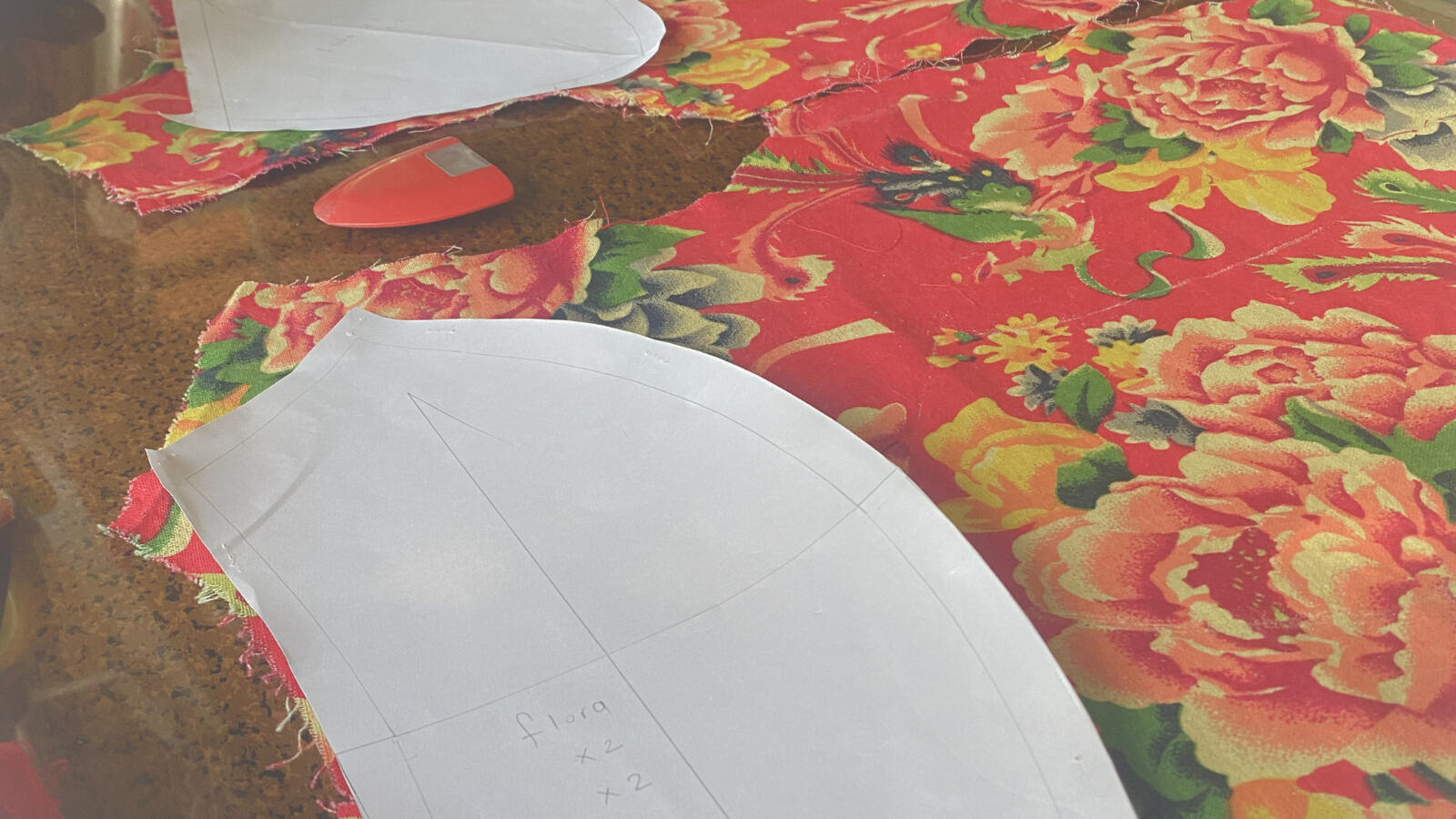 Pattern pieces, fabric fragments, and garment components used to construct a circular textile cushion.